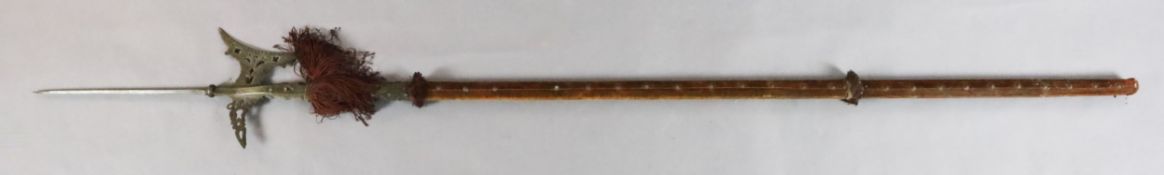 A Continental steel halberd, with pierced blade and velvet covered shaft, 87in.