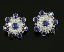 A pair of mid 20th century gold and platinum?, sapphire and diamond flower head cluster ear clips,