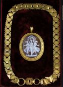 A Victorian gold mounted oval cameo mourning pendant, carved with the Three Graces, in fitted box