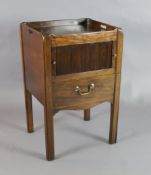 A George III mahogany tray top commode, with tambour fronted compartment and base drawer, on squared