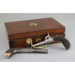A cased pair of early 19th century steel pocket pistols, with percussion locks, folding triggers and