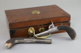 A cased pair of early 19th century steel pocket pistols, with percussion locks, folding triggers and