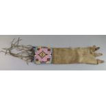 A Native American buckskin and beadwork gauntlet, Northern Plains, 19th century, with beaded