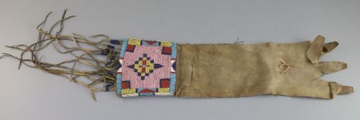 A Native American buckskin and beadwork gauntlet, Northern Plains, 19th century, with beaded