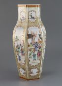 A Chinese famille rose 'mandarin' hexagonal baluster vase, Qianlong period, painted with court and