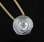 An 18ct white gold and solitaire diamond pendant, on an 18ct gold fine link chain, the round cut