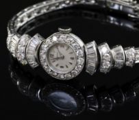 A lady's 1960's Art Deco style platinum and diamond set Movado manual wind cocktail watch, the