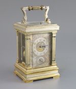 An early 20th century French silvered and parcel gilt hour repeating carriage alarum clock, in