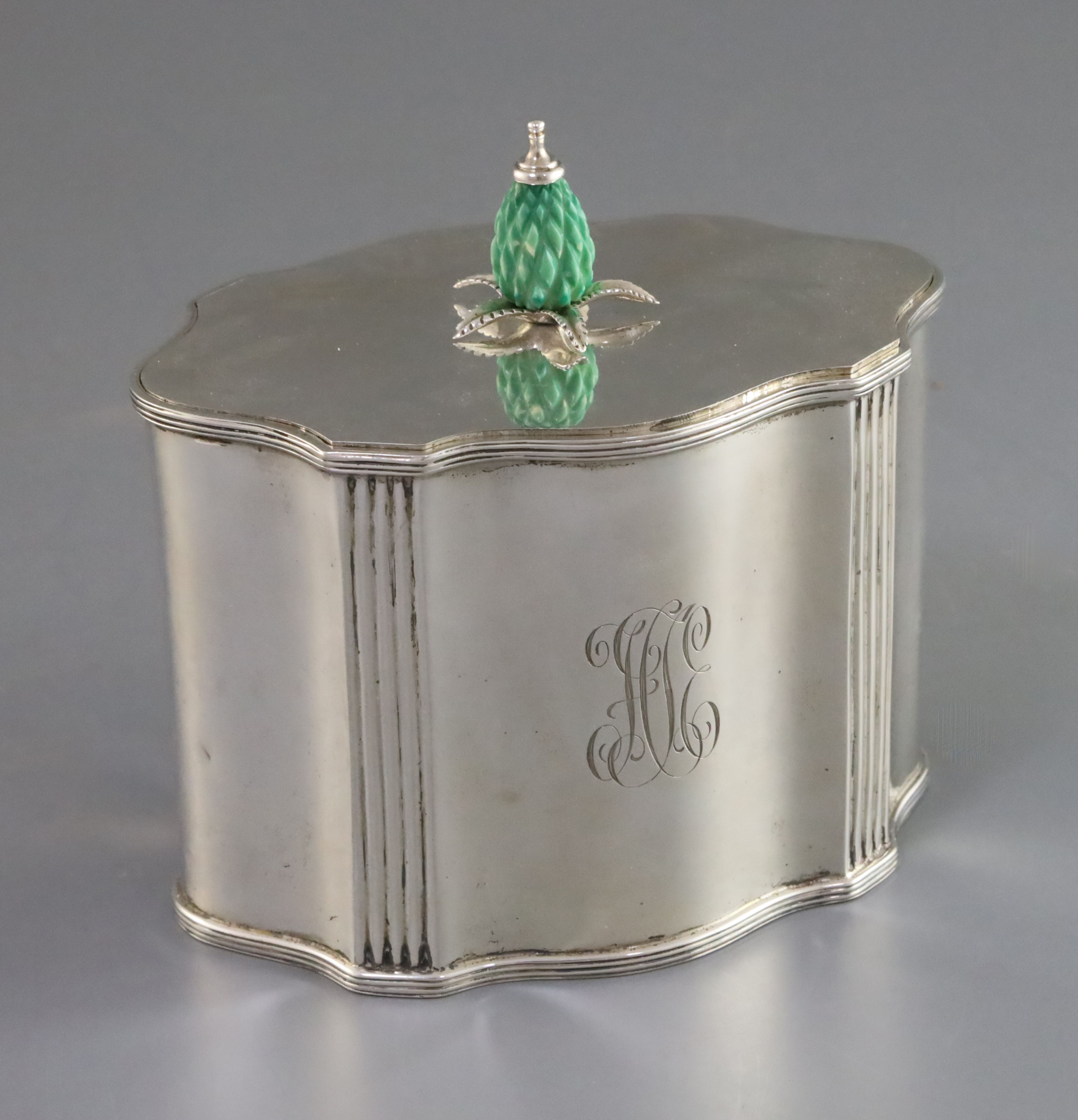 An Edwardian silver serpentine tea caddy with stained carved ivory knop, by James Parkes, with