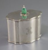 An Edwardian silver serpentine tea caddy with stained carved ivory knop, by James Parkes, with