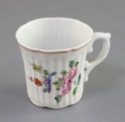 An early Worcester polychrome reeded heptafoil coffee cup, c.1754, painted with floral sprays,