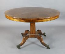 A Regency brass strung rosewood breakfast table, with circular tilt top, inlaid to the frieze with