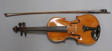 A French violin supplied by Antoine Curtil, Paris, c.1900-10, the two piece back of medium curl,