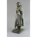 Louis Henri Nicot (1878-1944). A bronze figure of a Flemish woman holding an umbrella, signed,