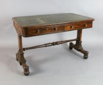 An early Victorian rosewood writing table, the rounded rectangular top with tooled green leather