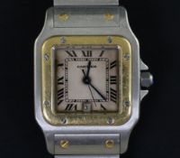 A gentleman's 1990's stainless steel and gold Cartier Santos quartz wrist watch, with Roman dial and