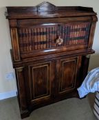 A Regency brass mounted rosewood secretaire a abbatant, the fall front inset with dummy bindings,