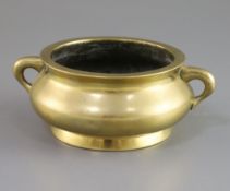 A Chinese polished bronze gui censer, Xuande mark, 18th/19th century, of squat baluster form,