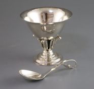 A Georg Jensen planished silver sugar bowl with everted rim on pierced foliate pedestal and circular