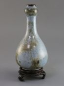 A Chinese Jun type garlic neck vase, Qing dynasty, Shiwan Kilns, the blue mottled glaze with brown