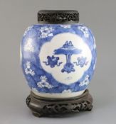 A Chinese blue and white 'Antiques' jar, Kangxi period, with three shaped reserves of 'Antiques'