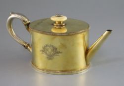An 18th century French silver gilt oval teapot by Henri-Auguste, Paris, 1786, with beaded borders,