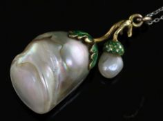 A gold and green enamel mounted natural saltwater oval and large baroque pearl pendant, on a