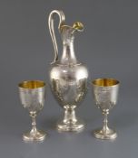 A Victorian silver ewer and a pair of matching goblets by Edward & John Barnard, the ewer of