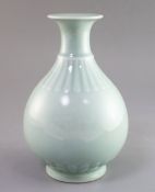 A Chinese celadon glazed bottle vase, yuhuchunping, Qianlong seal mark, perhaps Qing dynasty, H.