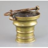A 15th century German or Flemish brass Holy Water bucket, with pierced cast handle, with dog's