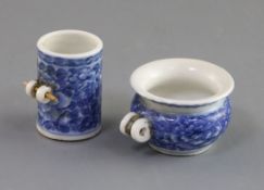 Two Chinese blue and white bird feeders, 19th century, of cylinder and squat baluster form,