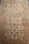 A North West Persian carpet, with field of scrolling foliage on a pale yellow ground, 17ft 7in by