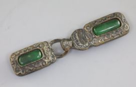 A Chinese bronze and jadeite mounted two piece belt buckle, the border cast with scrolls, L. 15.5cm