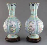 A pair of Chinese Canton enamel vases, early 20th century, each painted with birds and flower
