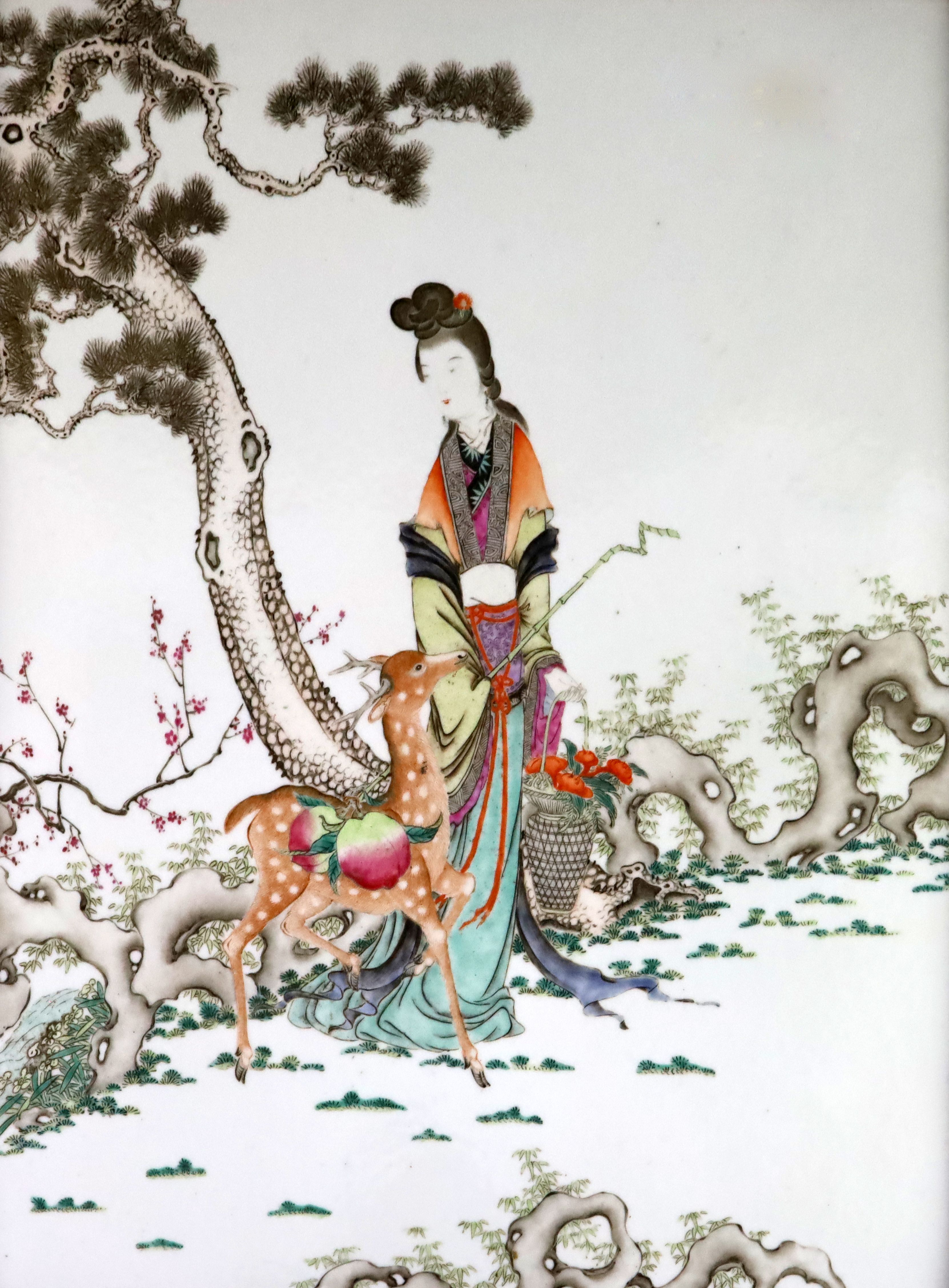 A Chinese famille rose 'He Xiangu' plaque, late 19th century, the immortal standing holding basket