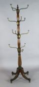 A Regency mahogany and brass hat stand, with four tiers of triple brass hooks and fluted downswept