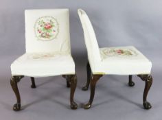 A set of six George II red walnut side chairs, with upholstered backs and seats on all round