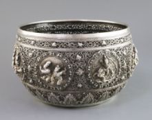 A late 19th century unusual Burmese reticulated silver bowl, decorated and embossed with circular
