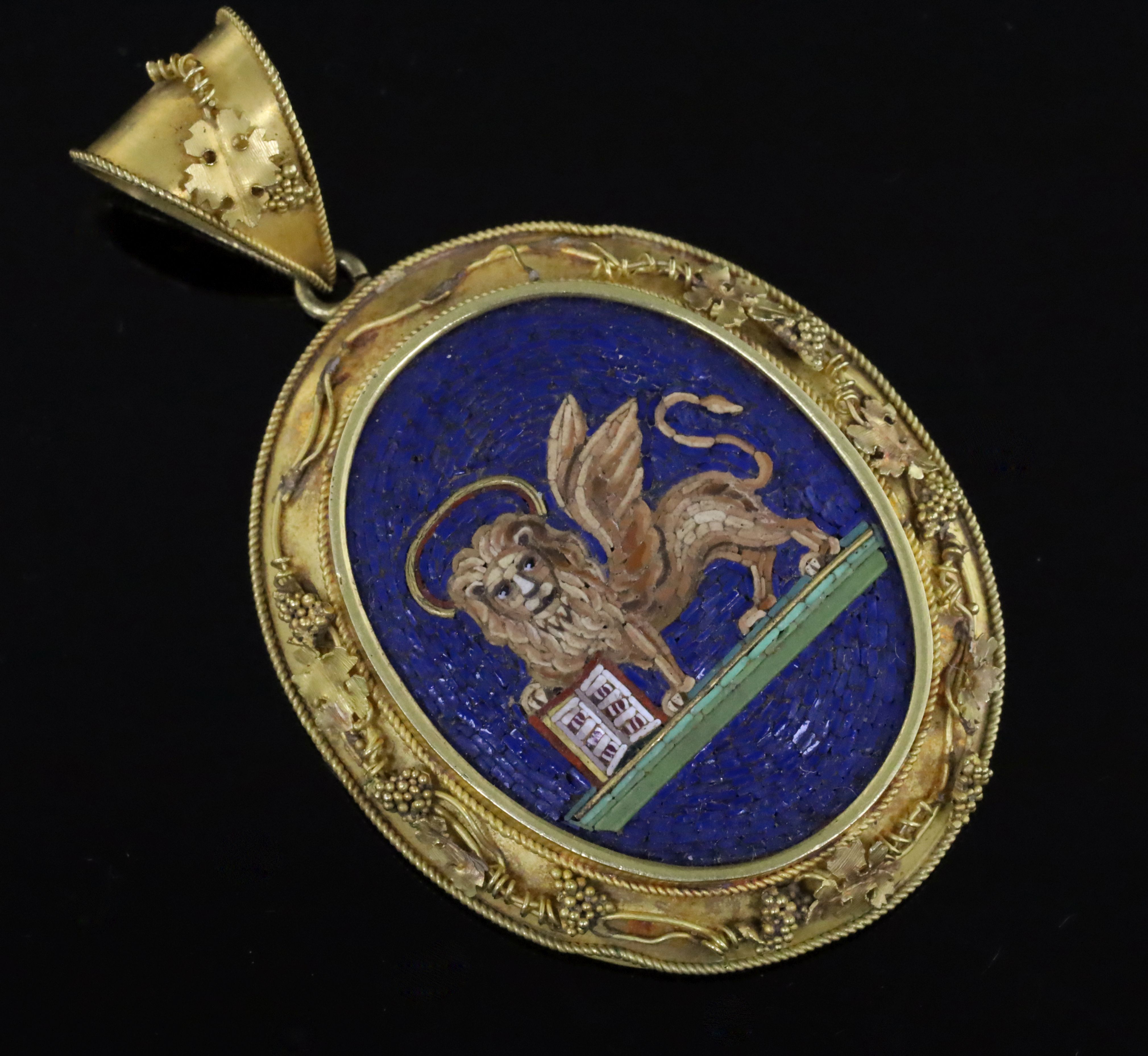 A Victorian gold mounted oval micro mosaic locket pendant, depicting the winged lion of St Mark,