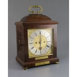 An early 20th century 17th century style walnut bracket clock, with square gilt brass dial and
