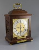 An early 20th century 17th century style walnut bracket clock, with square gilt brass dial and