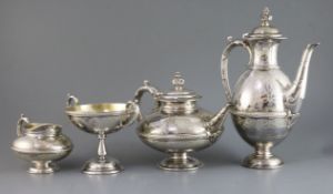 A Victorian four-piece engraved silver and silver-gilt pedestal tea and coffee service, by Frederick