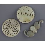 Two Chinese pale celadon jade plaques and a hair ornament, 19th century, the plaques carved and