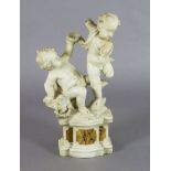 A 19th century Italian carved white marble group of two putti, standing upon a plinth with sienna