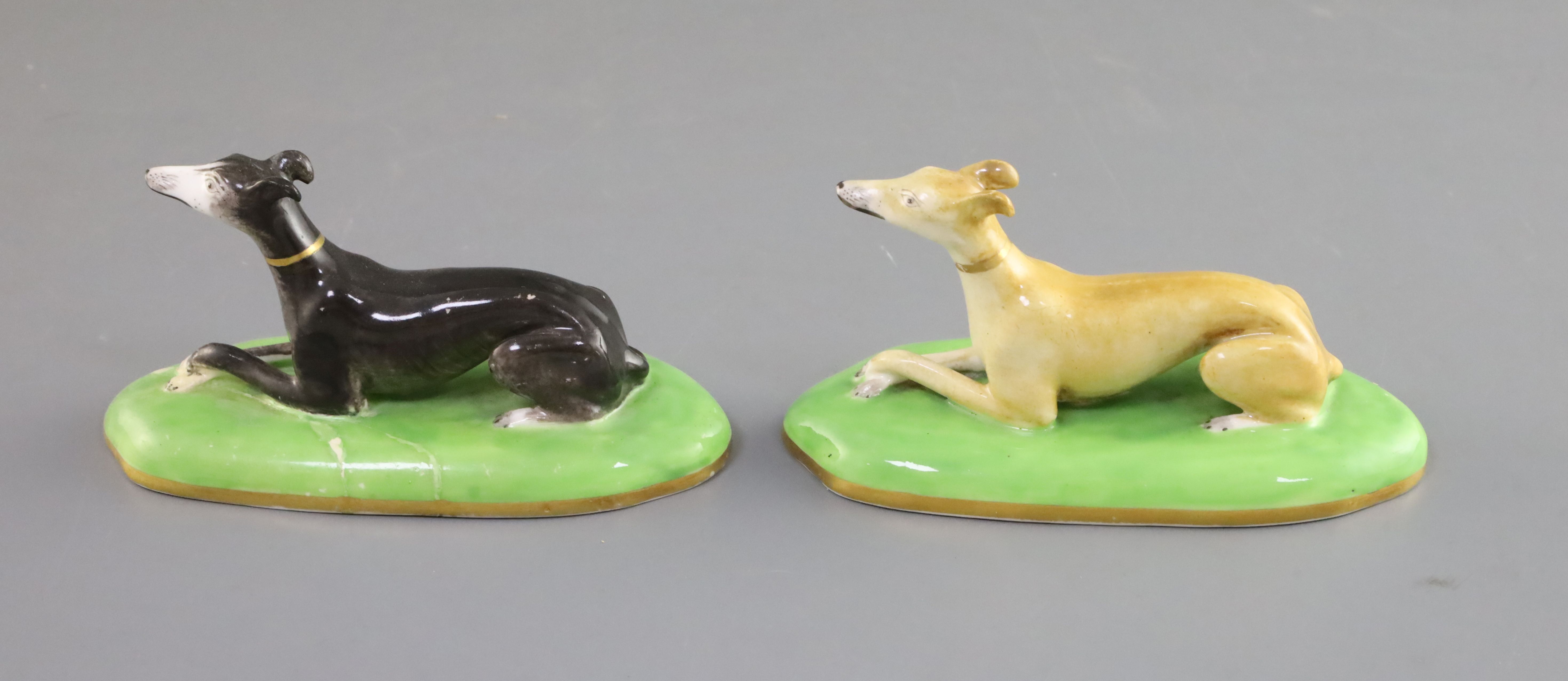A pair of Copeland & Garrett porcelain figures of greyhounds, c.1833-47, each recumbent on a shallow - Image 2 of 3