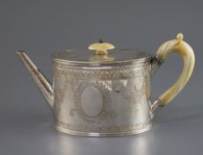 A late Victorian silver oval teapot by William & John Barnard, with ivory handle and knop and