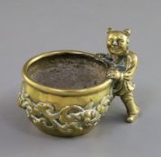 A Chinese polished bronze scholar's brushwasher, 17th/18th century, cast in the form of a boy beside