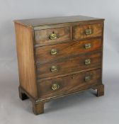 A George III mahogany chest, fitted two short and three graduated long drawers, on bracket feet, W.