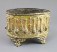 A Regency embossed and gilt brass jardiniere with tin liner, decorated with Grecian urns, 9.5in.