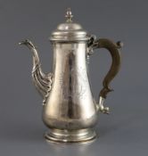 A George II silver baluster coffee pot by Thomas Whipham, with fluted spout and turned finial,